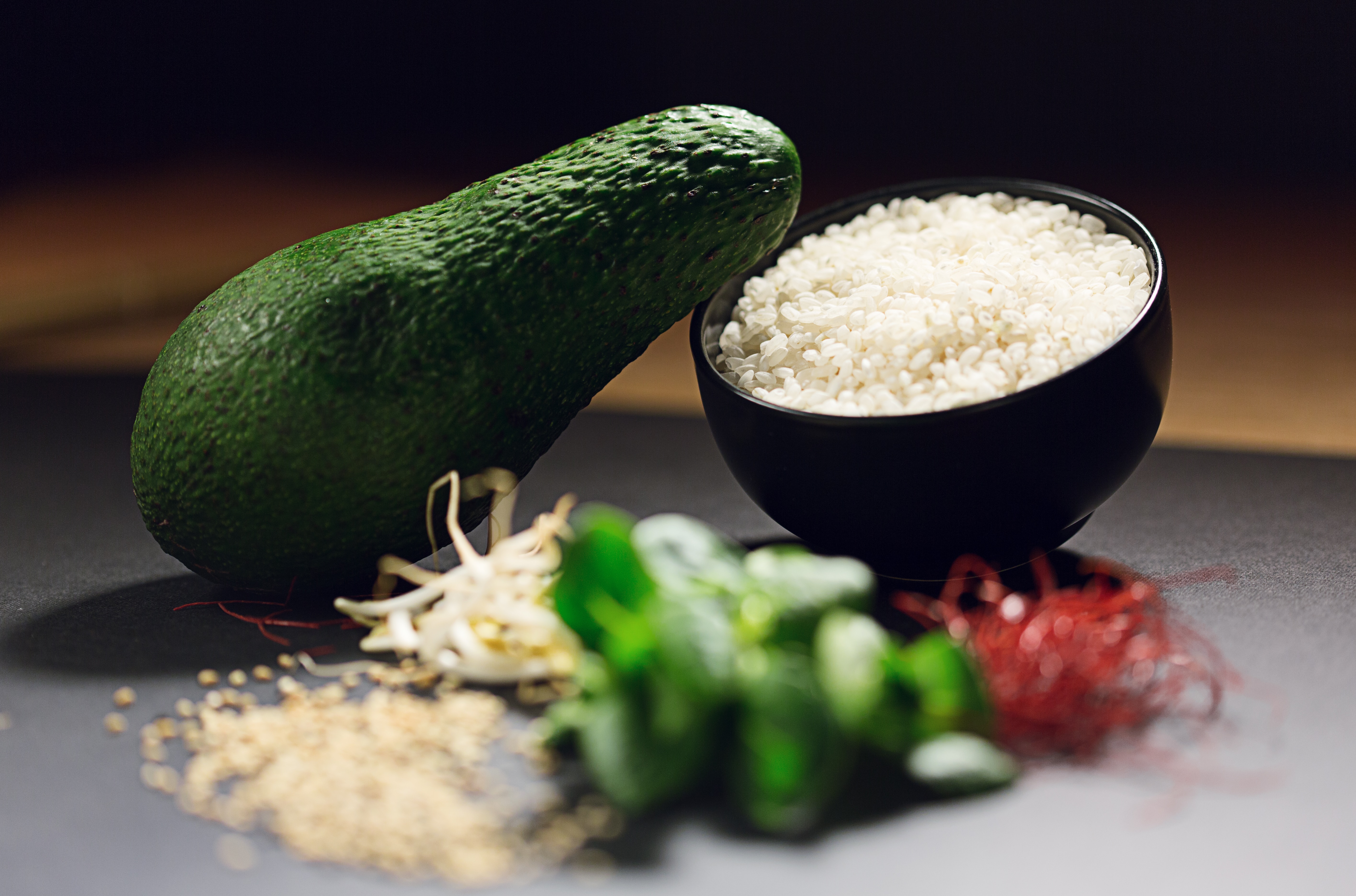 Avocado near cooked rice