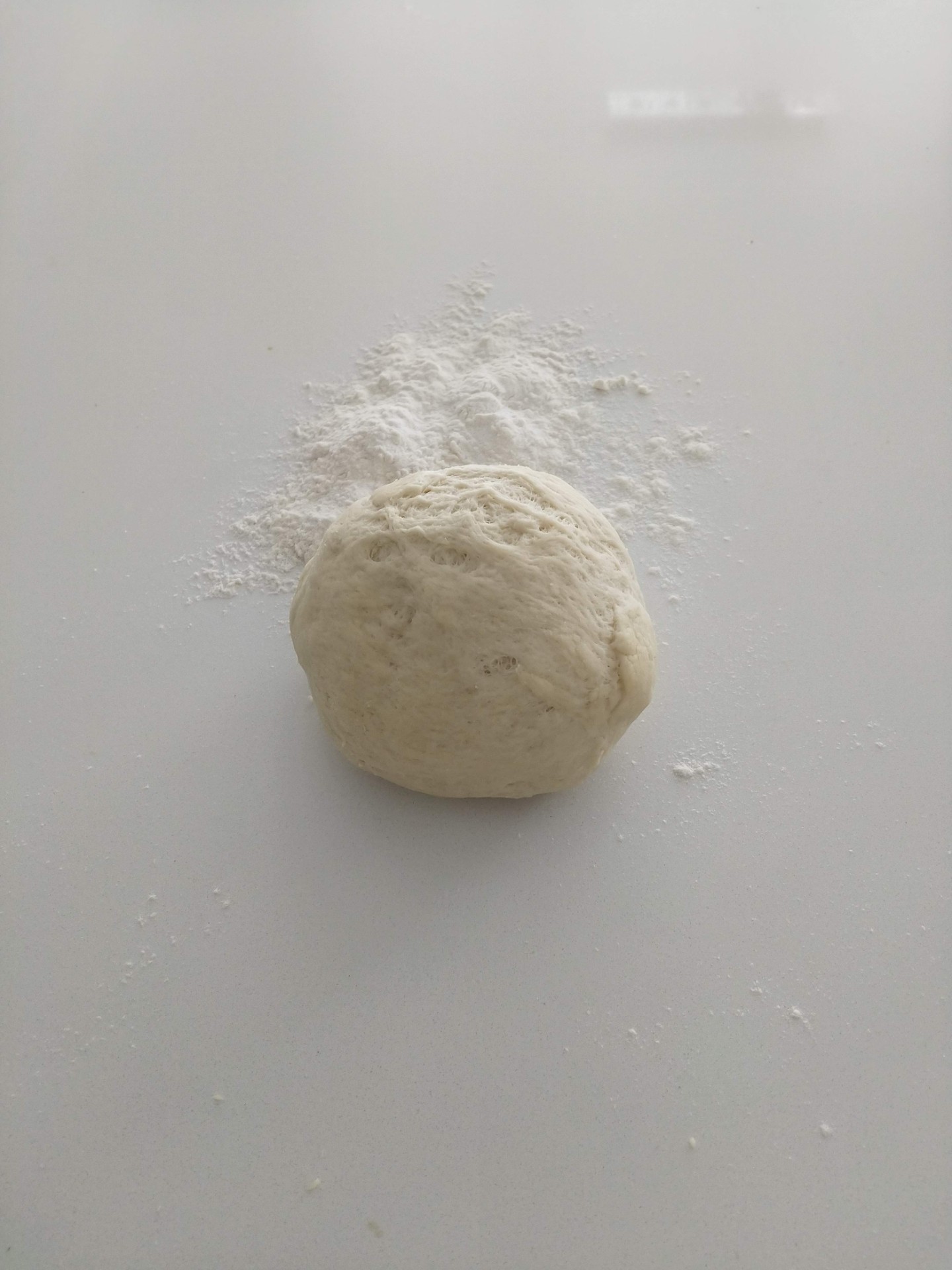 Pizza dough on counter