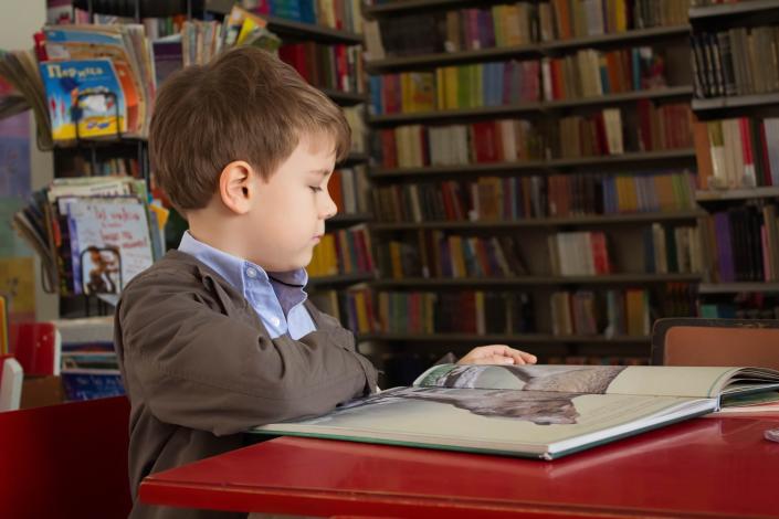 Boy sitting and reading