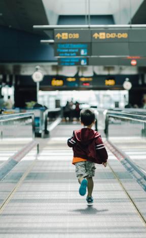 Child running in airport