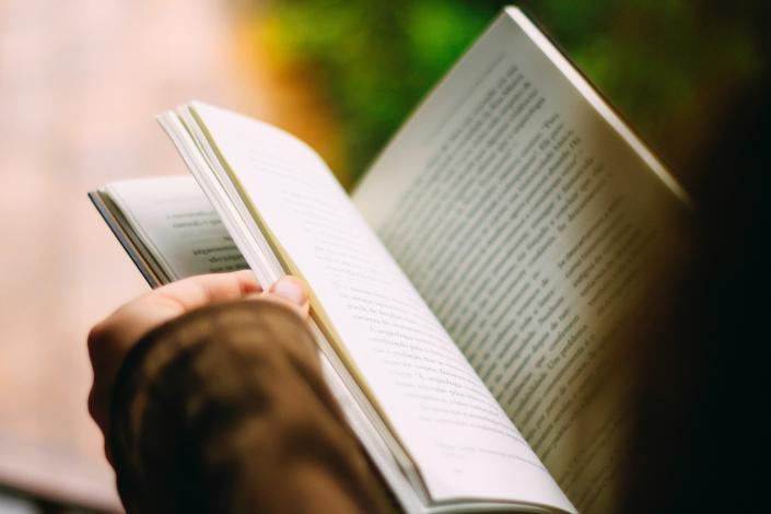 Person holding a book