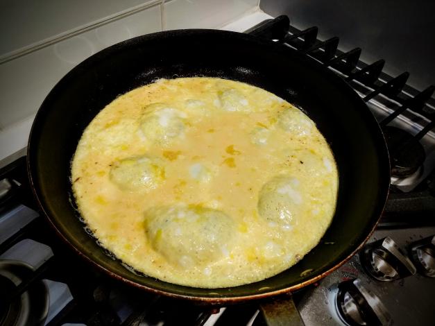 Mixed eggs in frying pan