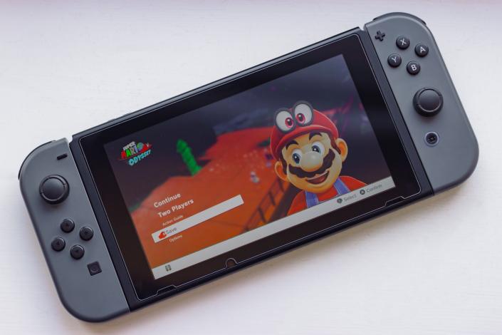 Nintendo switch with mario odyssey on it