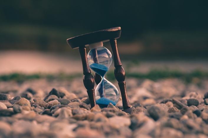 Hourglass on stones