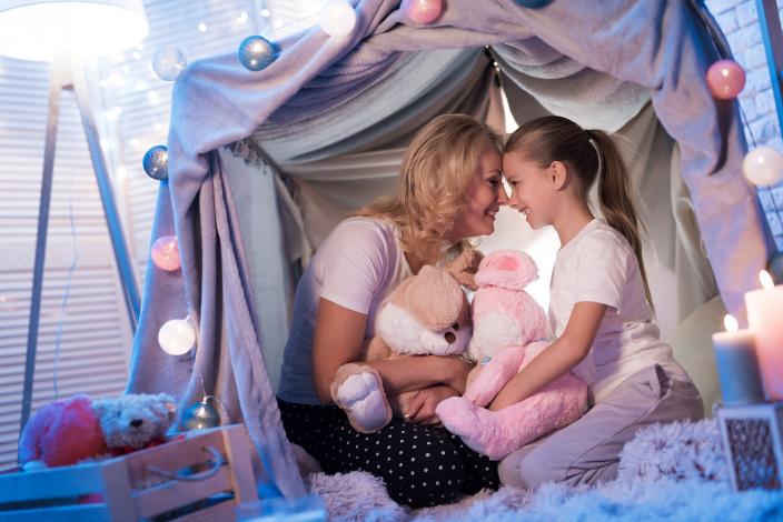 Mom and daughter in blanket fort