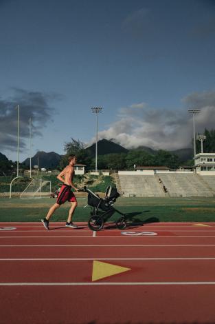 Man running with stroller