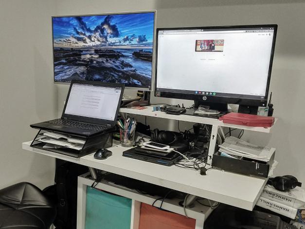 Monitors and computer on standing desk