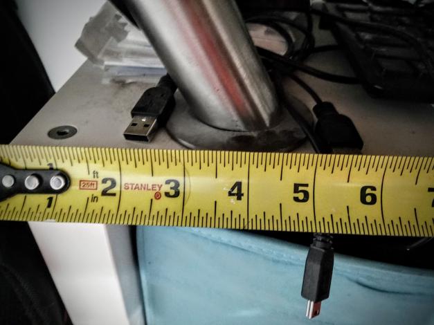 Tape measure showing distance on shelf