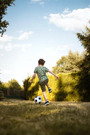 Boy playing soccer