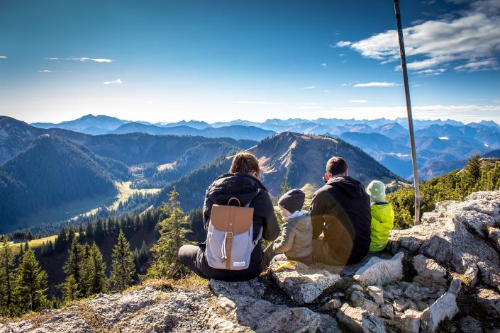 Kids and parents sitting on mountain