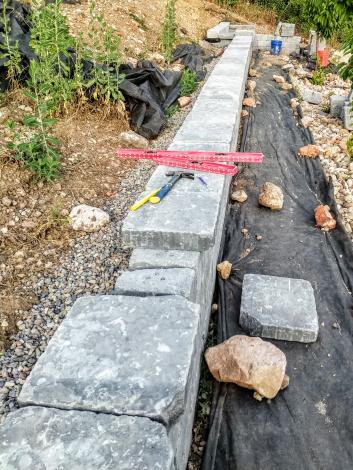 Top layer of rocks being added