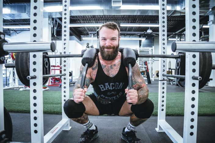 Man in weightlifting cage