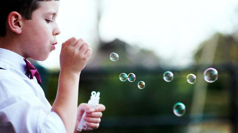 Boy blowing bubbles