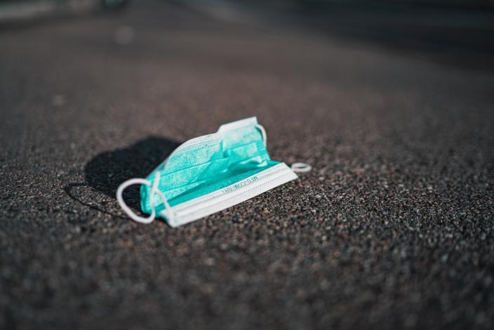 Medical mask on ground