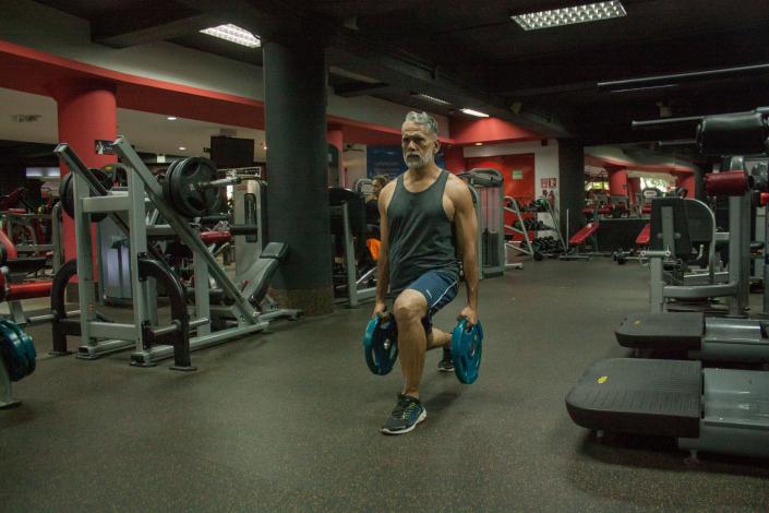Man doing lunge with weights