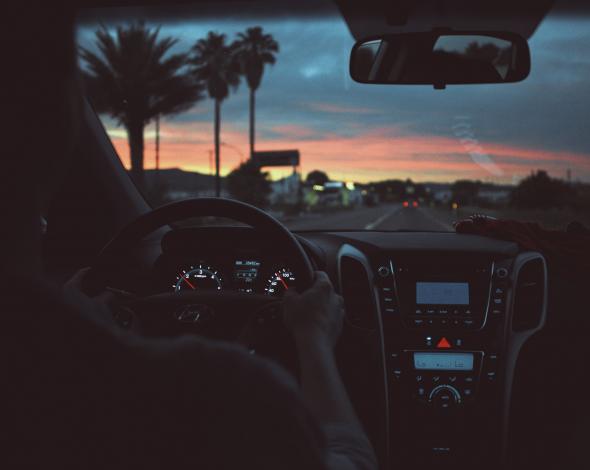 Driving car at sunrise