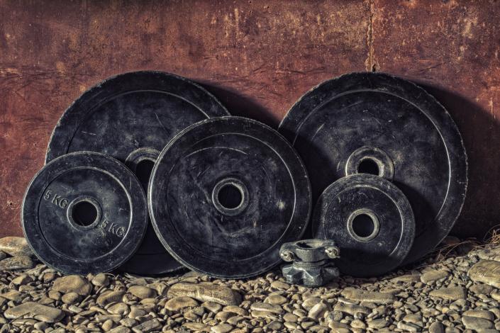 Weight plates leaning against wall