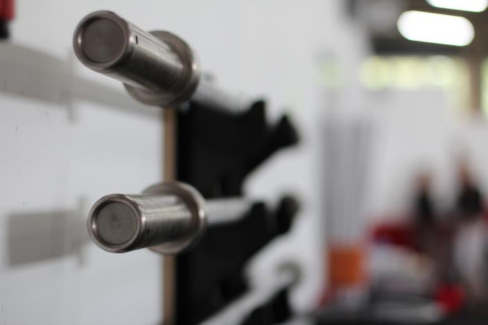 Barbells hanging on wall