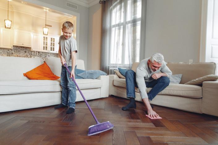 Photo of man and boy cleaning