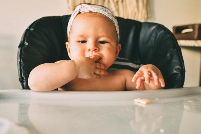 Baby eating crackers