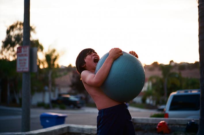 Boy holding yoga ball