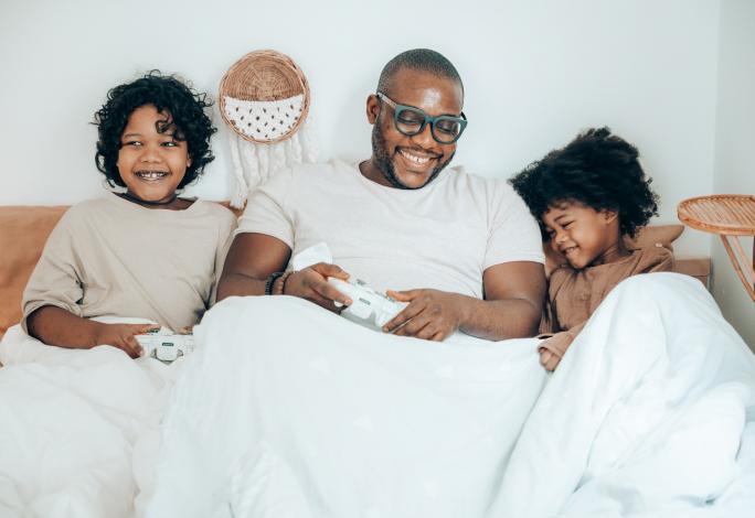 Father and kids playing video game