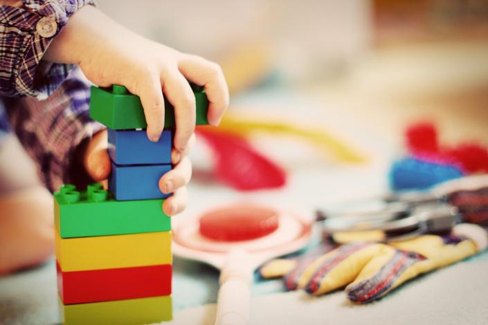 Child playing with LEGO