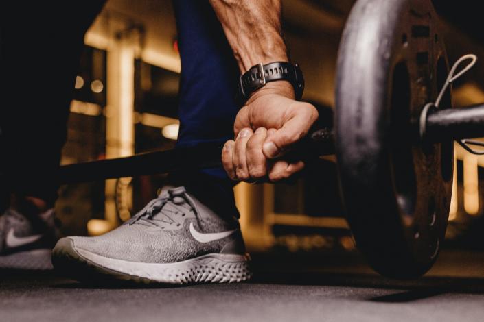 Person holding barbells