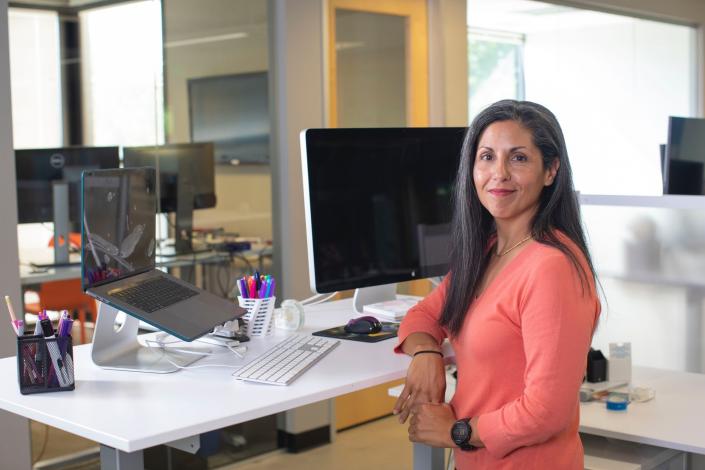 Woman standing at desk