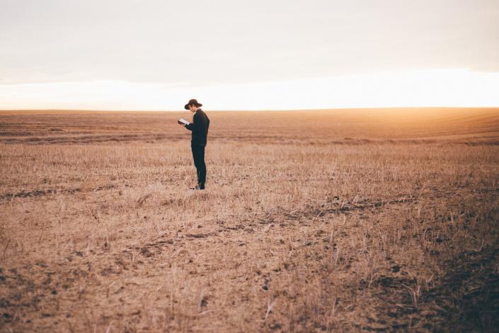 Man reading while standing