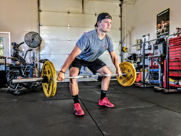 Man deadlifting at home