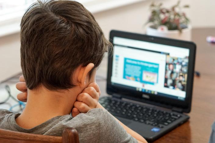 Child looking at computer
