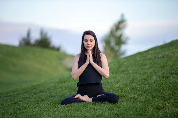 Woman sitting in yoga pose