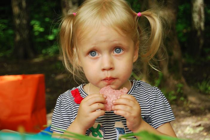 Girl eating salami