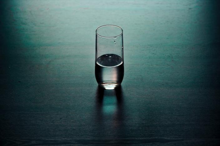 Clear drinking glass on table