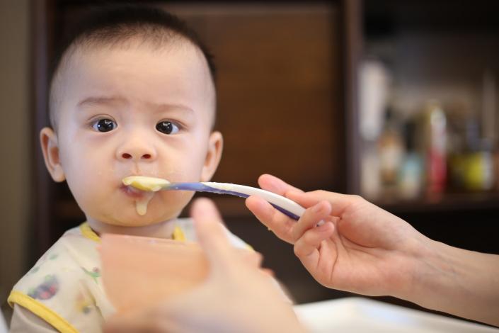 Baby eating baby food