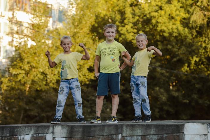 Three boys standing together