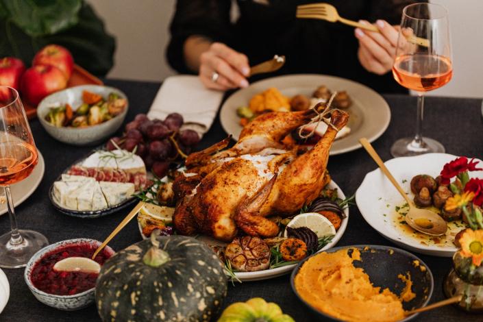 Roasted turkey surrounded by other food