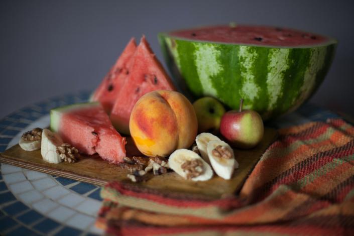 Several fruits on a cutting board