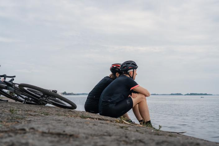 Bikers sitting on the beach