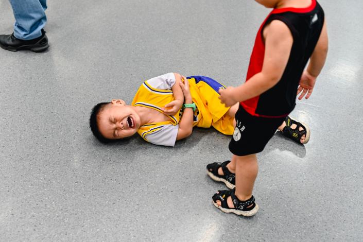 Child on floor crying