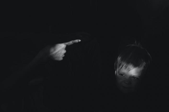 Parent pointing finger at child