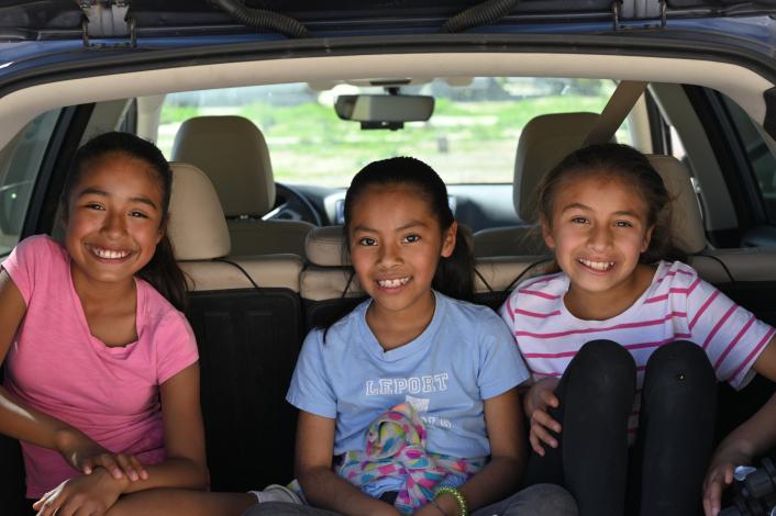 Kids in the back of a car