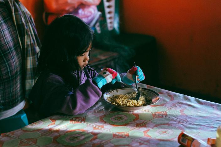 Child eating noodles