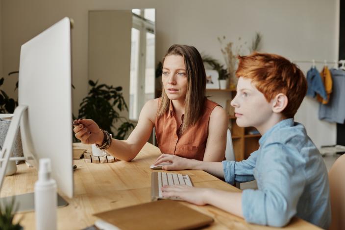 Woman and child at computer