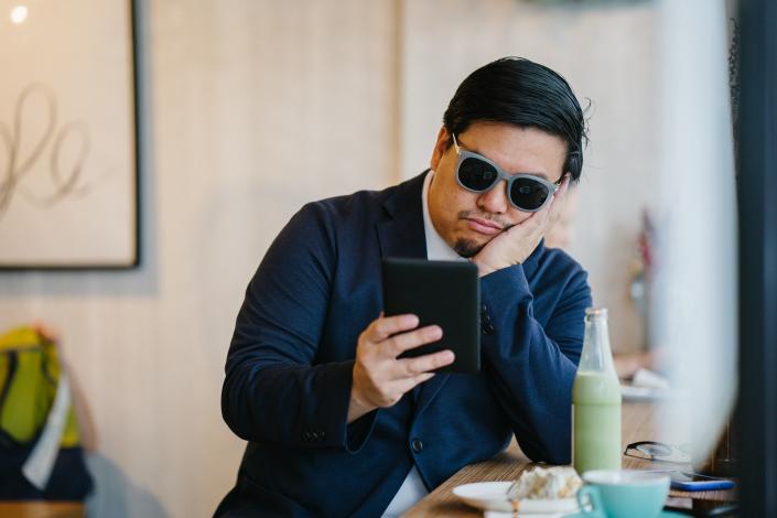 Man reading an e-reader