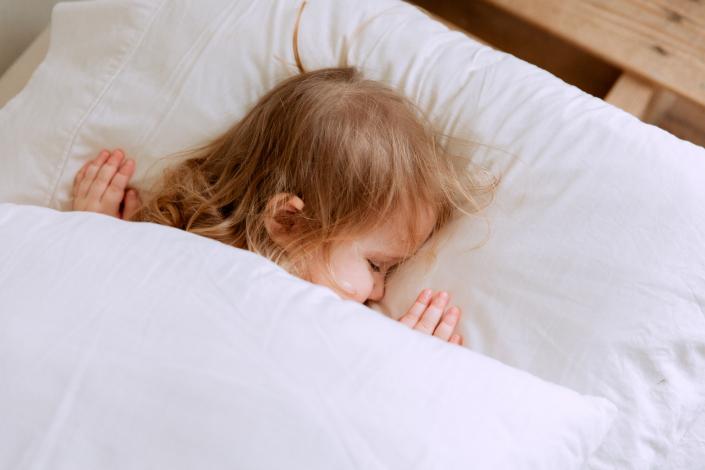 Child sleeping in bed