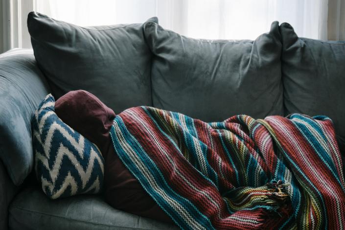 Person laying on couch