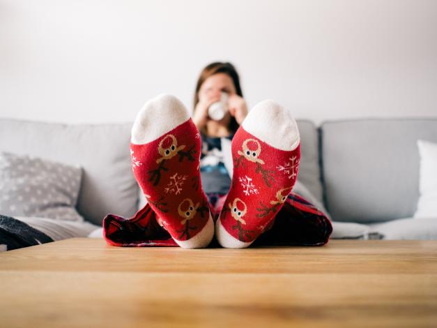 Woman with feet on table