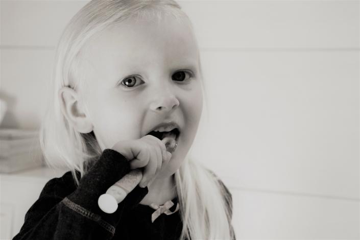 Girl brushing her teeth